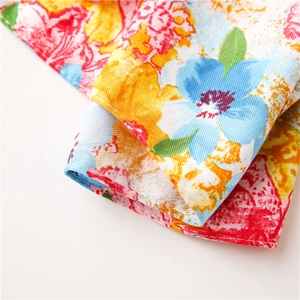 Macro detail of colorful oil painting floral print on cotton fabric with neat edge stitching