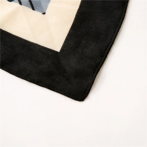 Macro detail of twill weave texture and geometric print on cotton linen scarf