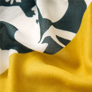 Detailed macro view of high-quality woven fabric with yellow and green color-block patterns
