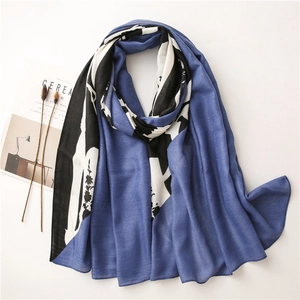 Women's long scarf with blue black white abstract color block design on a white background