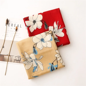 Lightweight cotton-linen scarf with elegant floral patterns on red and yellow fabrics