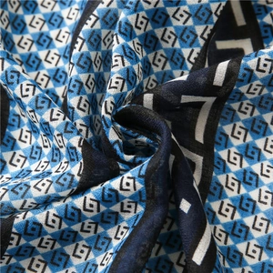 Detailed view of the woven fabric texture with geometric pattern and blue checkered base