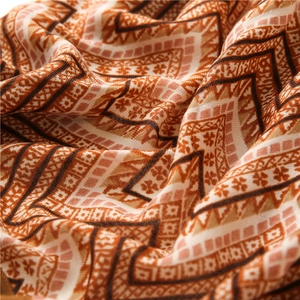 Macro view of geometric zig-zag pattern on soft breathable cotton-linen scarf
