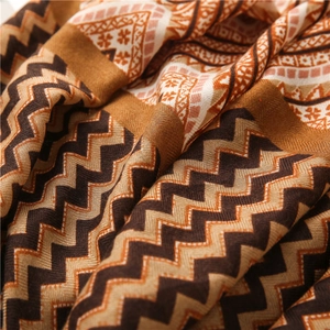 Macro detail of Bohemian geometric wave pattern on soft cotton linen scarf fabric