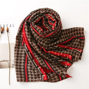 Detail of soft winter scarf with vintage geometric patterns and retro print layout