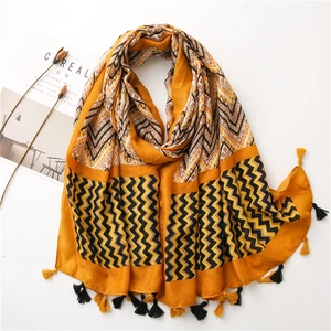 Zigzag geometric cotton linen scarf in orange with tassels and minimalist prop decor
