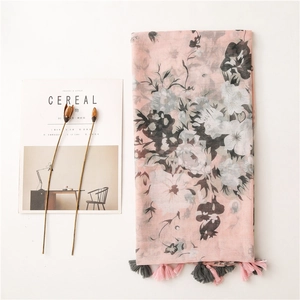 Pink floral lightweight scarf featuring grey flower prints and stylish fringed tassels