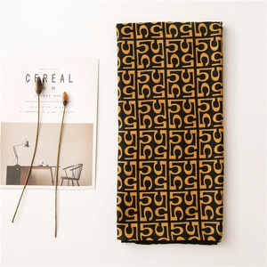 Detail of classic letter pattern scarf with retro geometric texture and soft fabric