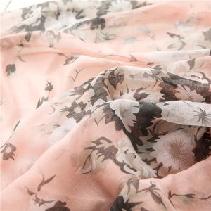 Detailed close-up of floral print chiffon shawl showing soft texture and pink fabric