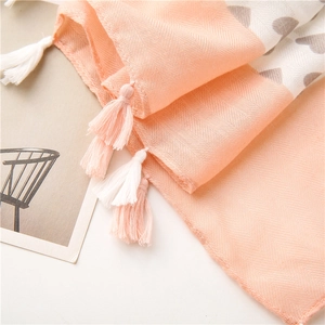 Detail of pink chevron weave and heart print cotton linen scarf with fringe tassels