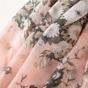 Close-up of floral print chiffon shawl showing sheer texture and delicate flower pattern