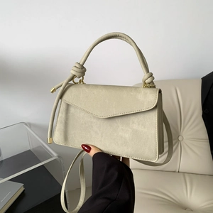 Elegant mint green flap handbag with knotted handle and adjustable shoulder strap