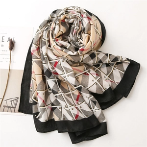 Detail of lightweight cotton linen scarf with geometric triangle pattern and black borders