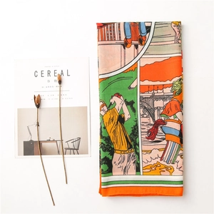Detail of vibrant orange silk scarf with vintage cartoon golf illustration and artistic print