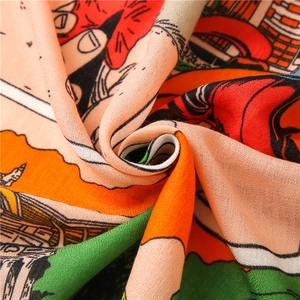 Close-up of vibrant horse carriage print scarf showing cross-weave fabric texture