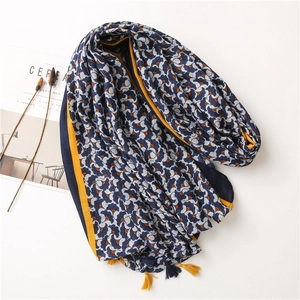 Blue cotton linen scarf with abstract fan prints and decorative yellow tassels