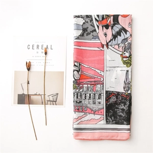 Detail of pink and grey comic style print scarf with soft texture and neat stitching