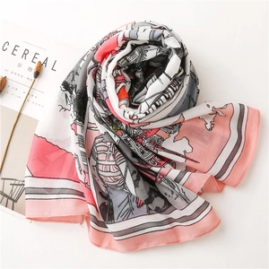 Detailed view of lightweight scarf with city illustration and pastel color blocking