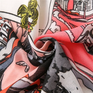 Close-up of lightweight printed scarf fabric showing detailed horse carriage patterns