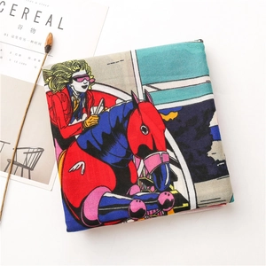 Detailed flat lay of a colorful carriage print scarf with artistic pop art patterns