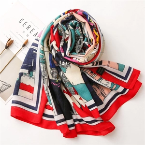 Detail of artistic cotton linen scarf featuring vintage pop art prints and red borders