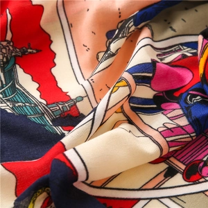 Macro shot of colorful horse carriage print fabric showing fine chiffon texture and detail