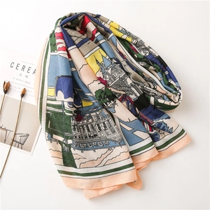 Detailed flat lay of colorful architectural print scarf with linen-feel fabric and magazine