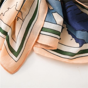 Close-up of the artistic floral print and soft fabric texture of this elegant scarf
