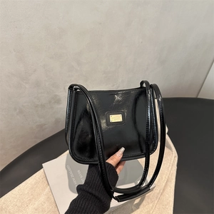 Glossy black underarm bag with gold metal plaque and double straps for women
