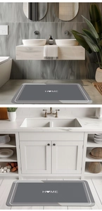 Macro detail of a grey diatom mud mat with white 'HOME' text and heart for modern bathroom use