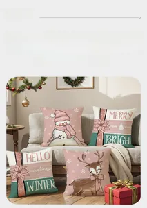 Detailansicht von vier Weihnachts-Leinenkissenbezügen mit festlichen Motiven wie Schneemann