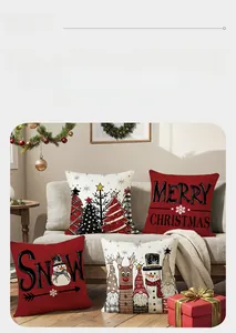 Detailed view of four Christmas pillow covers with snowman and deer festive prints