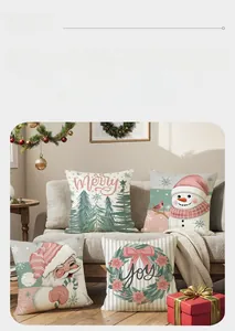 Detail of four pink and sage green Christmas pillow covers with snowman and holiday motifs