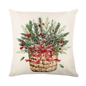 Christmas wreath cushion cover with festive pine branches and pinecones on white linen