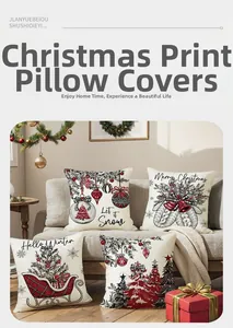 Set of four Christmas polyester pillow covers with red sleigh and tree prints on a sofa