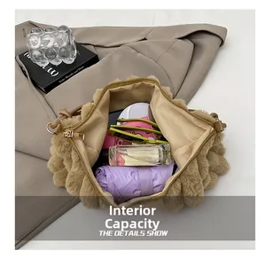 Interior capacity view of brown faux fur handbag showing storage space for daily essentials