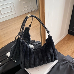 Chic black plush shoulder bag with striped texture and adjustable leather strap for women