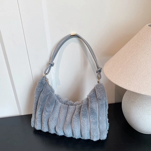 Light blue faux fur shoulder bag with soft vertical stripes and a sleek metal strap buckle