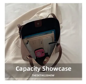 Detailed view of the large capacity tote bag interior with umbrella and tablet storage