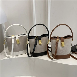 Fashion Stitched Canvas And PU Leather Bucket Bag For Women Trendy Crossbody Shoulder Handbag With Metal Lock