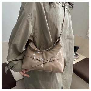 Detail view of khaki glossy leather hobo bag with adjustable silver metal buckle