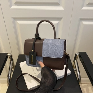 Contrast color patchwork crossbody bag with brown leather and blue denim textures
