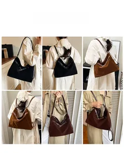 Detailed view of the large matte tote bag with leather straps and metal buckles