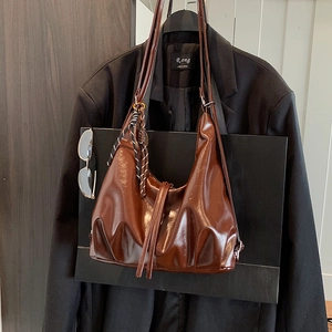Brown vintage glossy leather hobo bag with large capacity and woven rope charm