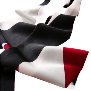 Elegant burgundy color block skinny silk scarf featuring geometric black and white accents