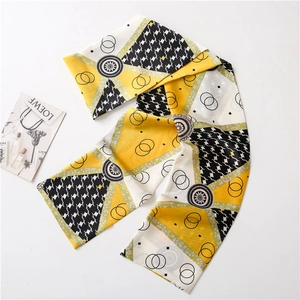 Slim silk scarf with yellow geometric star patterns and houndstooth on white background