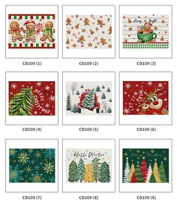 Selection of nine Christmas linen placemats featuring gingerbread men and snowmen motifs