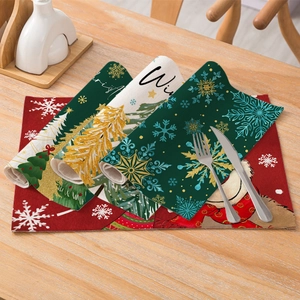 Linen cotton Christmas placemats with reindeer and snowflake patterns on wooden table