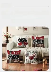 Detail of four Valentine cushions with heart and plaid patterns on a white sofa