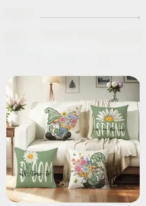 Set of four spring flower throw pillow covers with gnome motifs on a white sofa